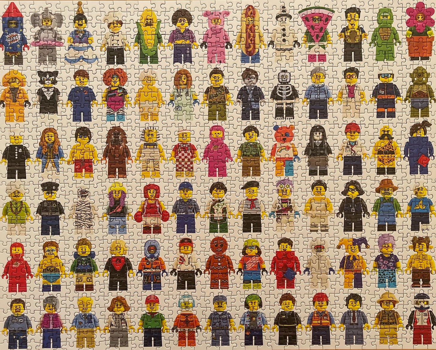A picture of a 1000-piece puzzle picturing LEGO characters that I happened to finish some weekends ago.