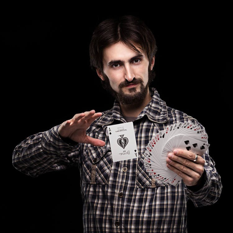 Free Person Doing Card Trick Stock Photo