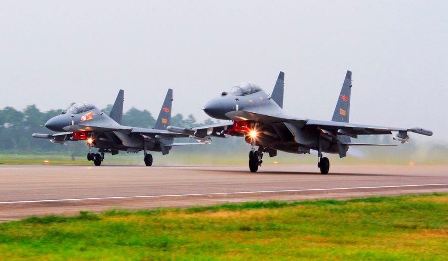 In this undated file photo released by China&#39;s Xinhua News Agency, two Chinese SU-30 fighter jets take off from an unspecified location to fly a patrol over the South China Sea. China flew more than 30 military planes, including SU-30 fighter jets, toward Taiwan on Saturday, Oct. 3, 2021, the second large display of force in as many days.(Jin Danhua/Xinhua via AP) **FILE**