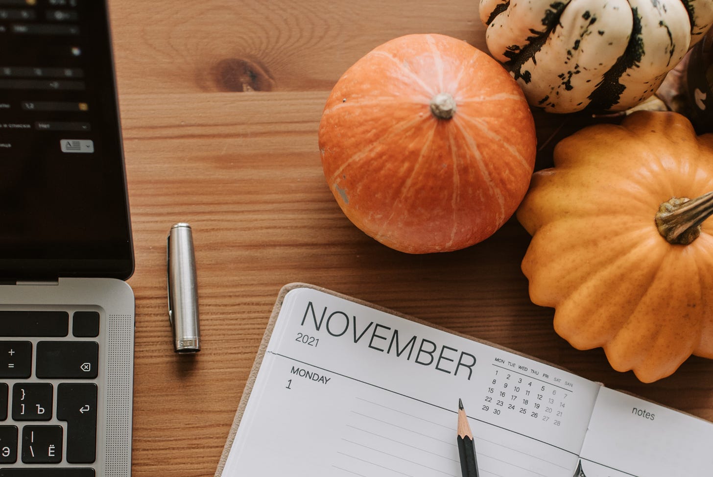 picture of laptop, november calendar, and squash