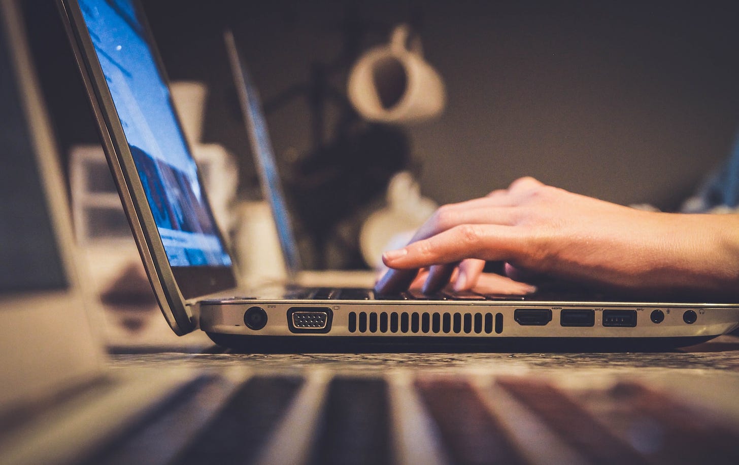 A person typing on a laptop.