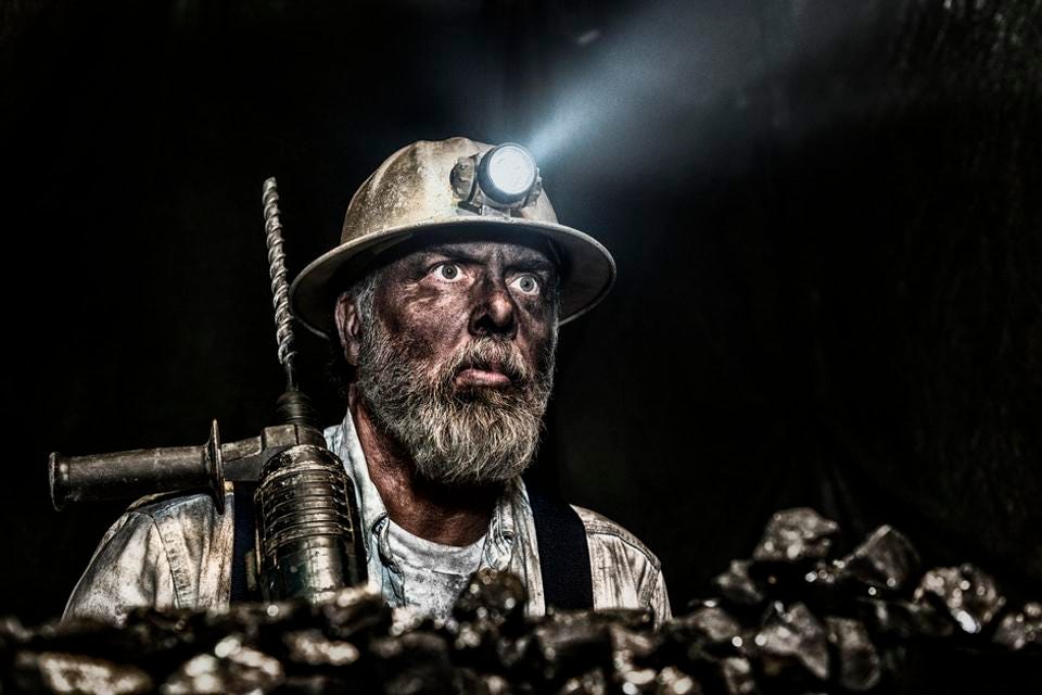 Coal miner wear hardhat with a hammer drill