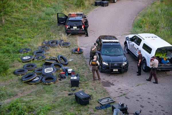 The authorities searched the area near the Apple River with metal detectors after five people were stabbed while tubing down the river on Saturday.