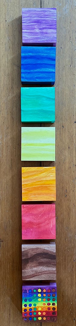 Eight canvases painted during Omer 2022/5782 in one long tall photo, going in order: Purple, Blue, Green, Yellow, Orange, Red, Brown, all 49 pairs of the Omer.