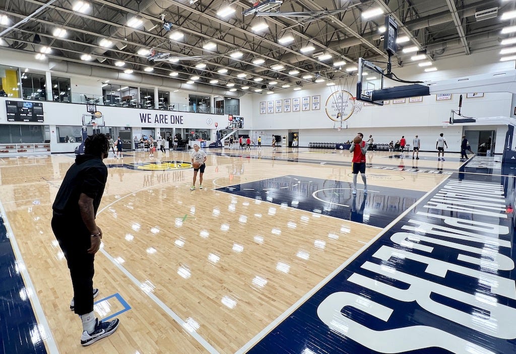James Johnson shoots with assistant coach Jenny Boucek at their final practice before opening night on Oct. 19.  The Pacers begin a new season in the comfort of their own home.  It’s three straight at Gainbridge Fieldhouse to start the 2022-23 season. And there’s as much newness and excitement surrounding the team as there is to see the renovated Fieldhouse ready for prime time after the completion of $360 million in upgrades. (Click here to listen on Apple Podcasts)  “Camp has been good,” said head coach Rick Carlisle, who enters his second season leading the team. “It gets a little long at this point so it’s gonna be good to have our regular crowd in there on opening night. We’ve got an exciting young group that’s anxious to play.”  Turner’s been here since 2015 and there are a lot of new faces. He hasn’t played in a game since mid-January because of a foot concern, so he hasn’t played since Domantas Sabonis was traded and Tyrese Haliburton joined the squad.  He’s entering his eighth season whereas many of the players on this roster were just becoming teenagers then. So his message to them is to relish the moment.  “You’ve worked your entire life to get to this point, now you just let it all hang out,” Turner said before opening night. “You went through the preseason, you went through the draft process, you went through training camp, now it’s time for the real thing. Once that moment hits, these guys will be just fine.”  There are seven newcomers, including three rookies. Daniel Theis (right knee soreness) won’t play and Aaron Nesmith (plantar fascia, left foot) is unlikely to go. He hasn’t been a full participant in almost two weeks.  It’s Tyrese Haliburton’s team and No. 6 pick Bennedict Mathurin is ready to add his intensity, athleticism and desire to win on this team. Both players have a good chance of being special players, not just in Indy but also in the entire NBA.  Turner said he felt camp was best for getting acclimated with everyone and for the young guys to just play.  “Just being together, getting chemistry and letting guys get reps,” he said. “I think repetition is so huge in this league. You can try to do it in practices, but preseason and actually playing in some games against real competition — that’s the best way to do it. I always call it Trial by Fire, just get out there and just go. That experience is crucial.”  Turner’s Block  Bally Sports+  Two to share in PA Announcing Duties  DJ … on the court  Gold Out  And once again, it’s a gold out at the home opener. All fans will receive this t-shirt.