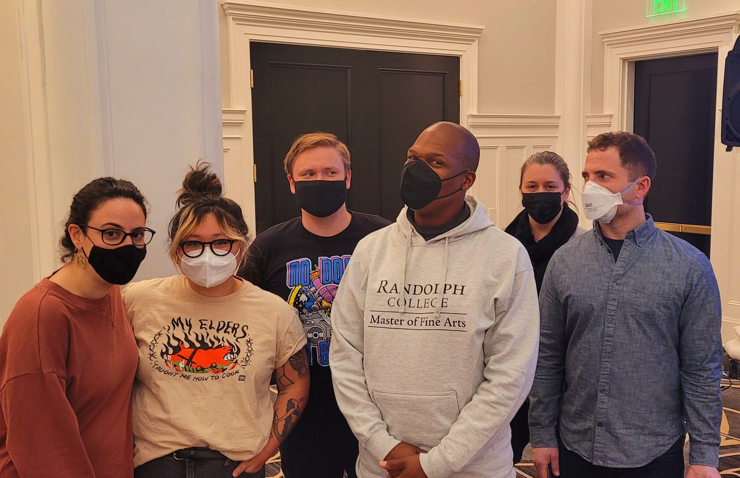 6 Randolph writers wearing face masks and posing for a group photo
