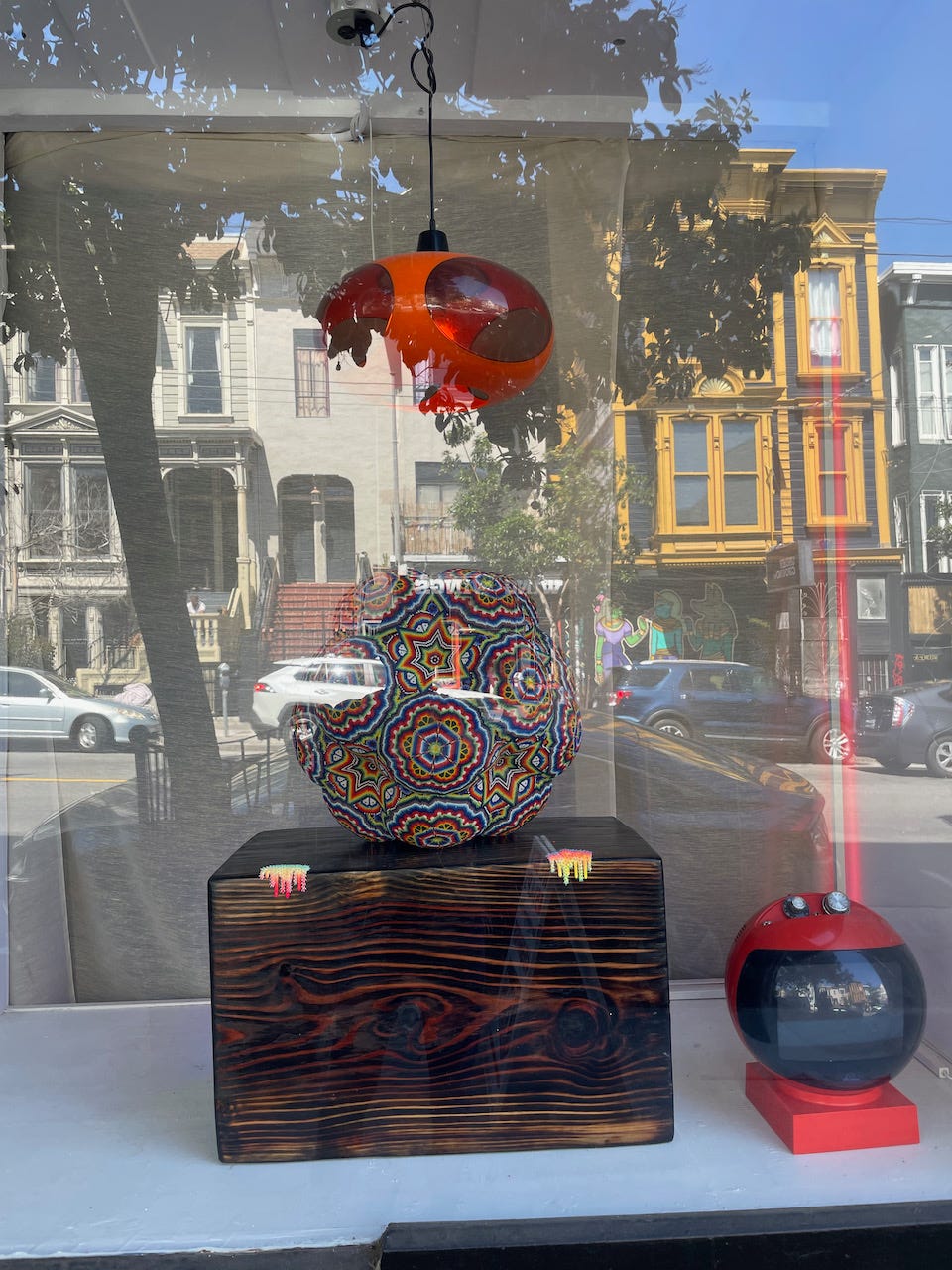 Image of a window with reflections on lower Haight Street