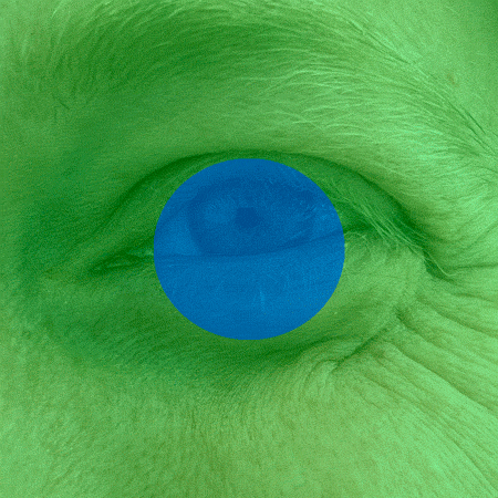 An animated-loop of a close-up photo of a left eye open in surprise and then crinkling into a smile. The eye is blue with light skin, though the whole frame is superimposed with a green transparency. Over the iris in the center of the frame is a blue transparent circle that doesn’t move throughout the animation.