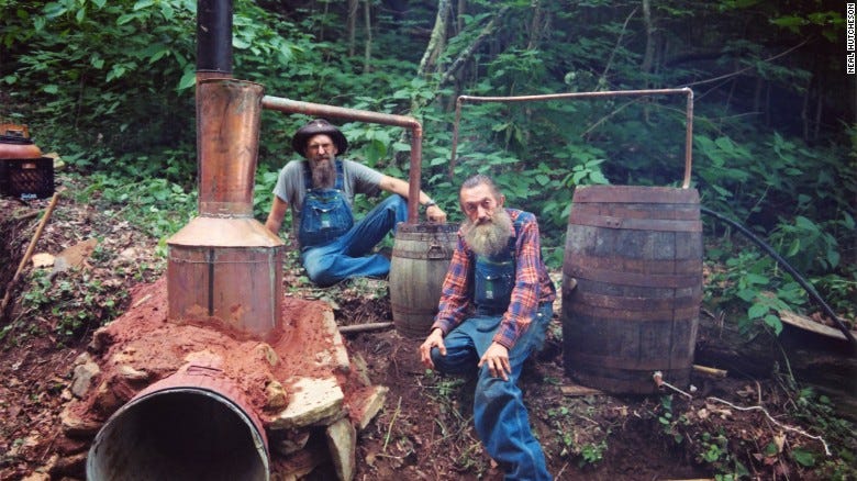 Marvin &quot;Popcorn&quot; Sutton (right) - one of the legends of bootlegged moonshine, with his largest ever still. But the industry is entering a new, legitimate era.