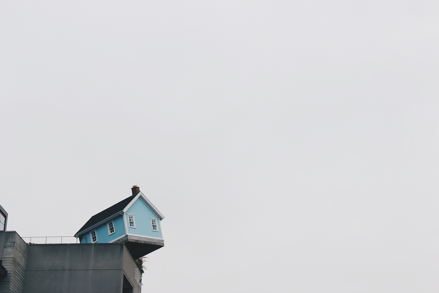 blue concrete storey house on top of building at daytime photo