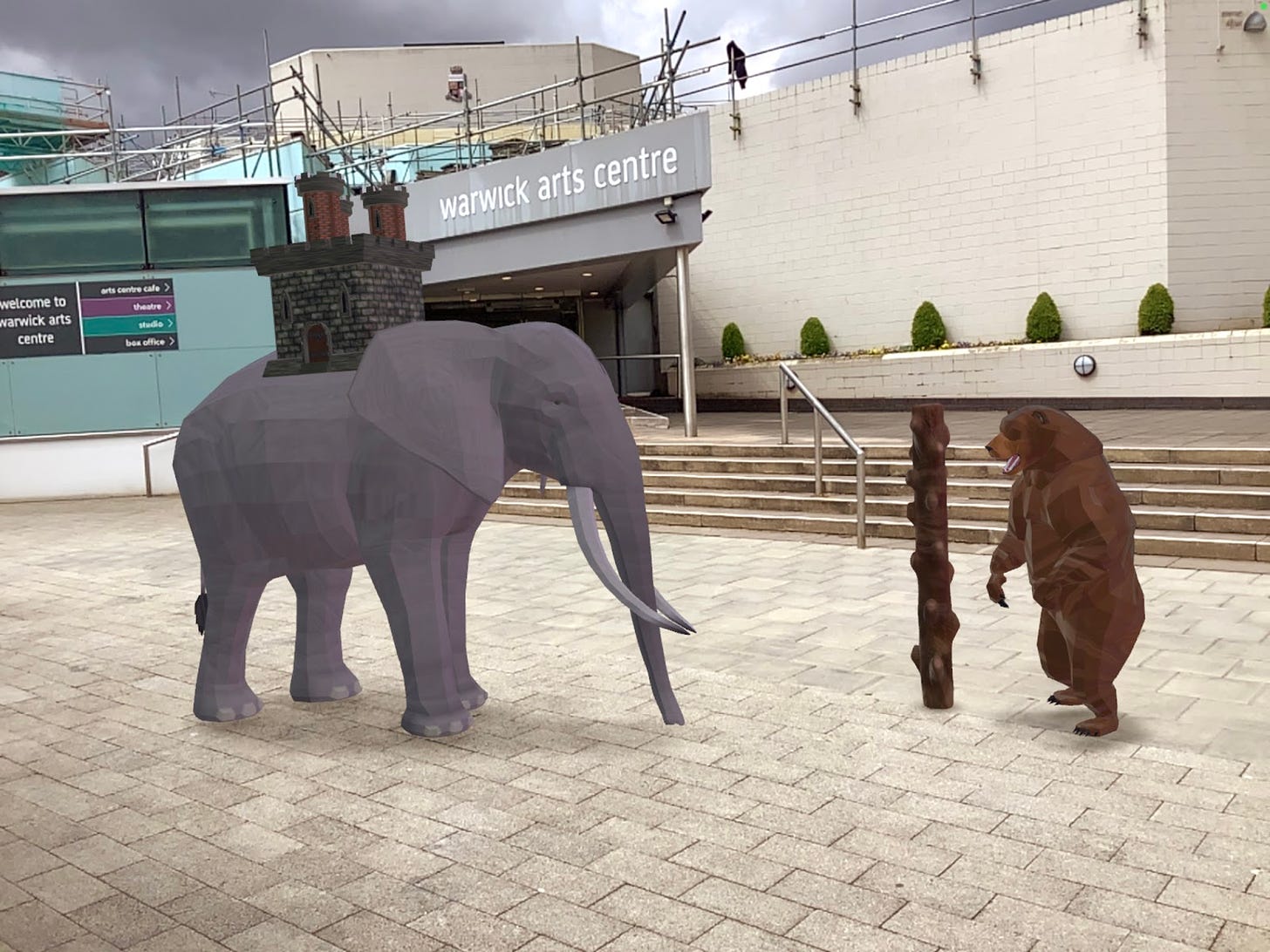 a photograph showing a 3D bear and elephant viewed outside of Warwick Arts Centre using augmented reality technology