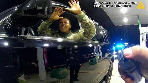 In a still image from footage taken by Officer Joe Gutierrez’s body camera, Second Lt. Caron Nazario is seen being pepper-sprayed during a traffic stop at a gas station on Dec. 5.