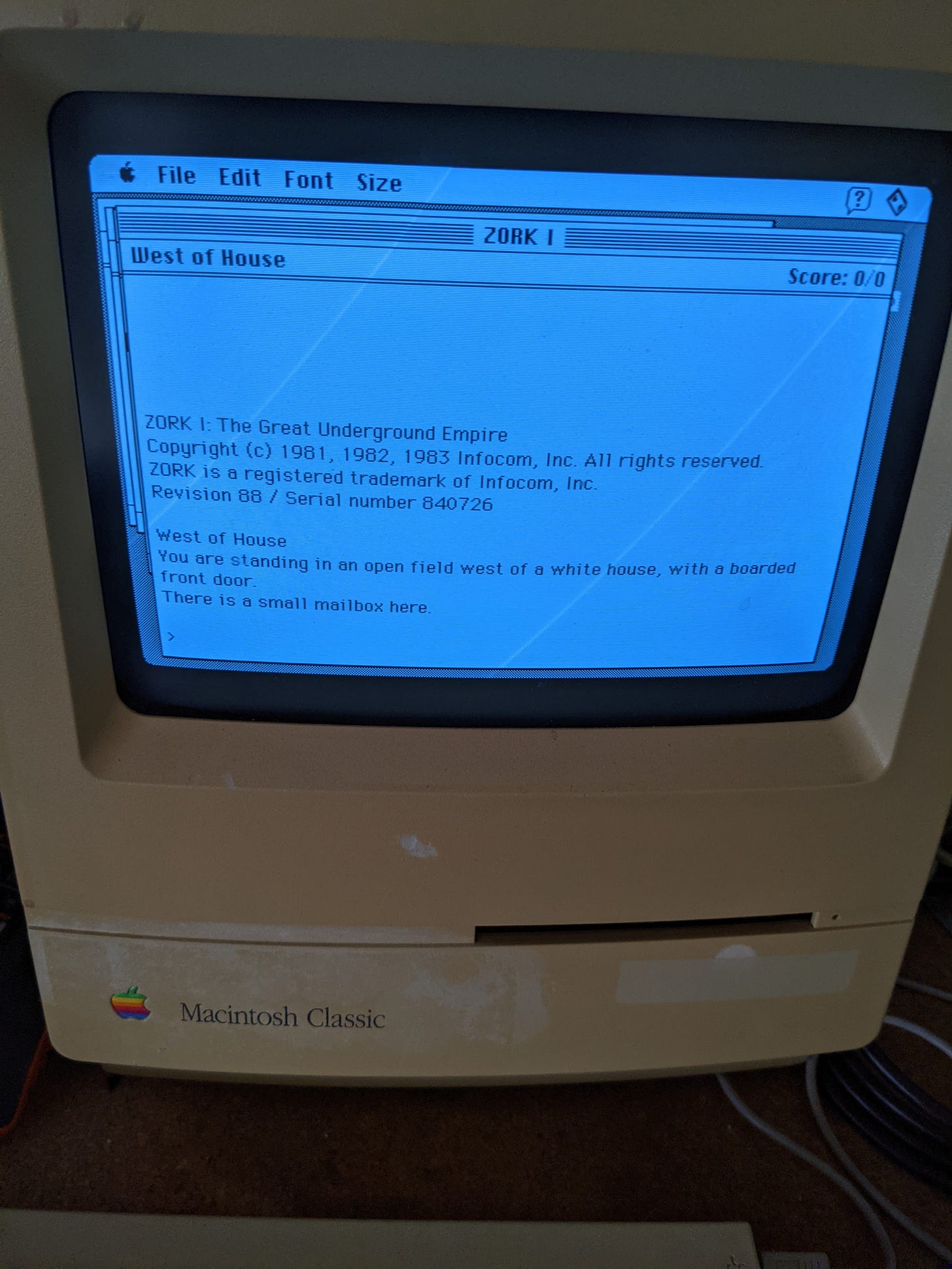 The screen of a Macintosh Classic personal computer. The computer is running the text adventure ZORK. The screen of a Macintosh Classic personal computer. The computer is running the text adventure ZORK.