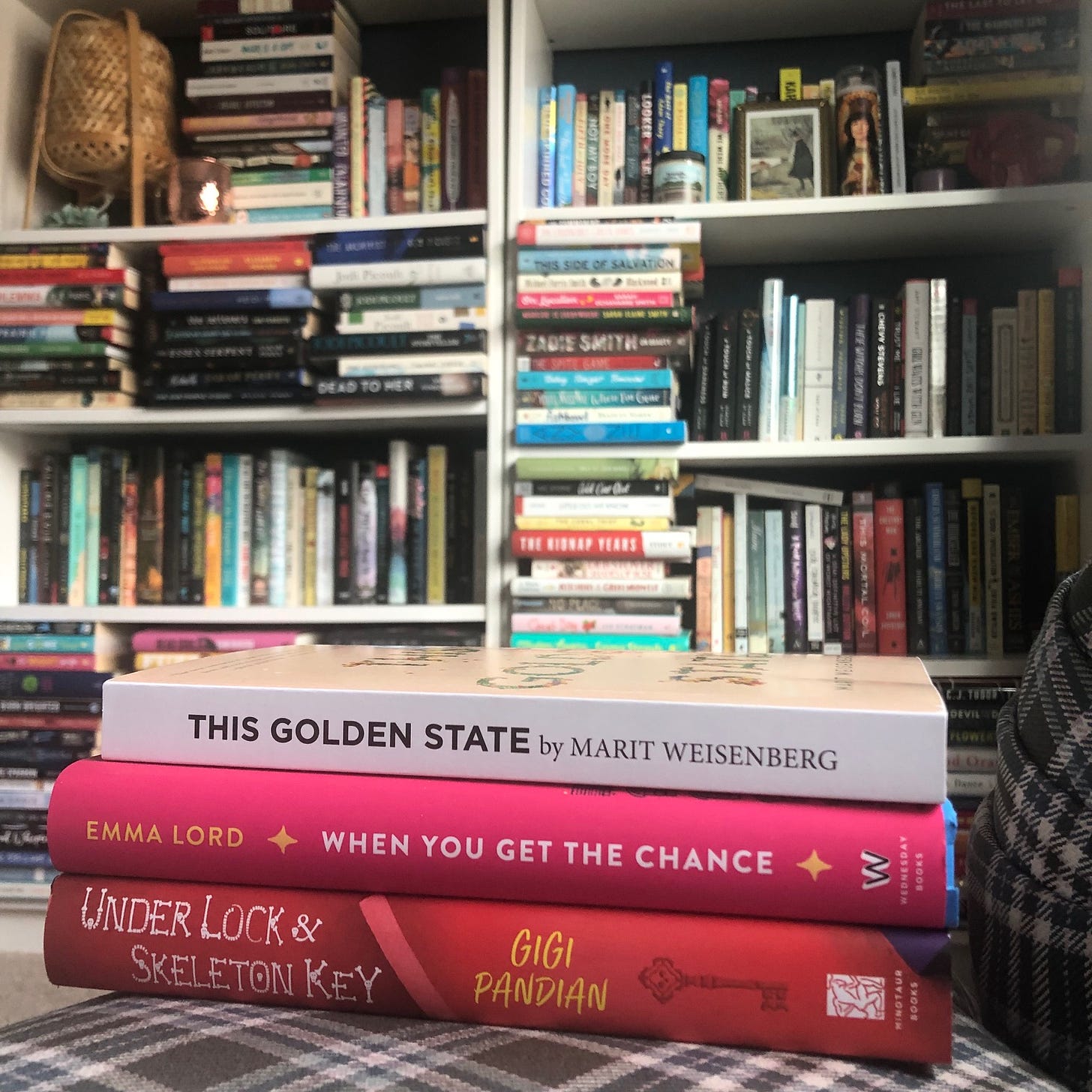 Books pictured: This Golden State by Marit Weisenberg, Under Lock & Skeleton Key by Gigi Pandian, and When You Get the Chance by Emma Lord. 
