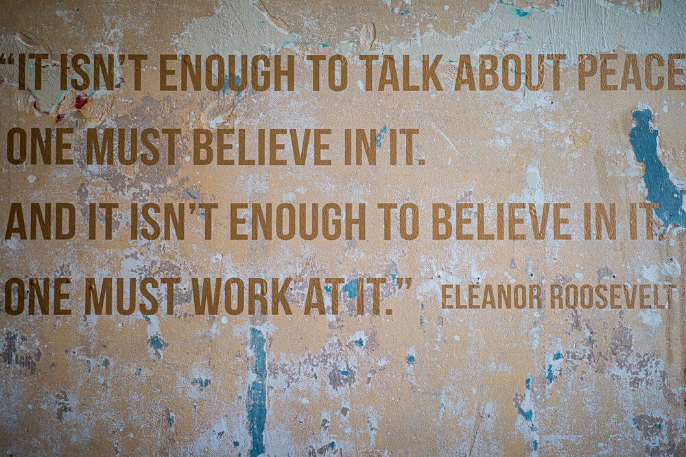 Eleanor Roosevelt’s quote on the wall at Refuge Coffee Co. “It isn't enough to talk about peace. One must believe in it. And it isn't enough to believe in it. One must work at it.”  Art design by  _@chase.moore .
