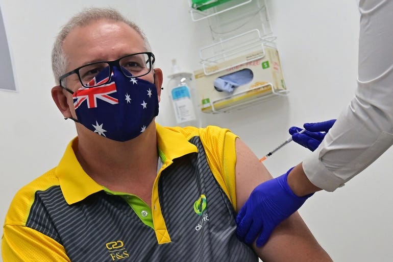 Australia's Prime Minister Scott Morrison receives a dose of the Pfizer-BioNTech COVID-19 vaccine at the Castle Hill Medical Centre in Sydney on February 21, 2021 [Steven Saphore/ AFP]