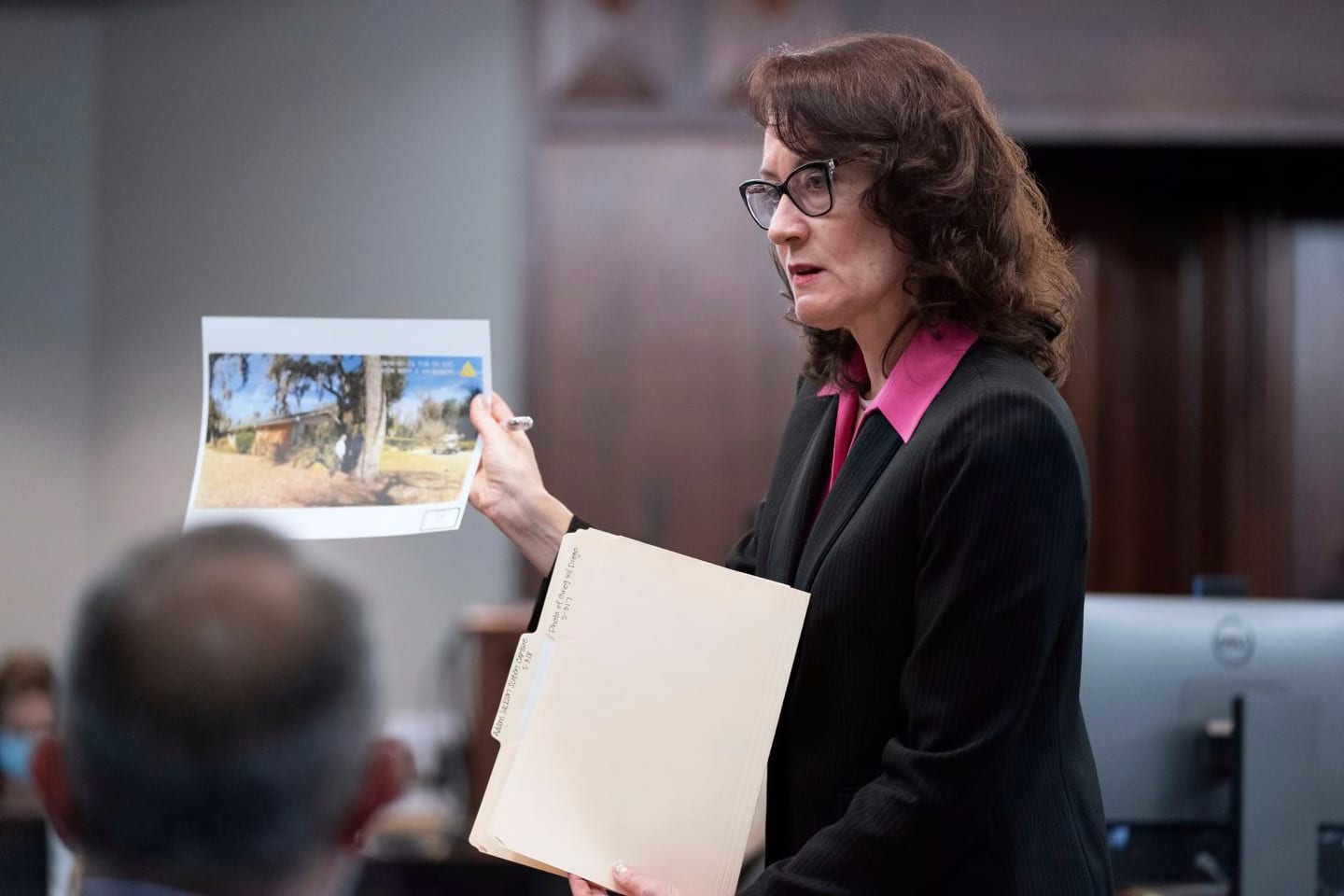 Prosecutor Linda Dunikoski shares evidence during trial at the Glynn County Courthouse, Monday, Nov. 8, 2021, in Brunswick, Ga. Greg McMichael and his son Travis McMichael and a neighbor, William "Roddie" Bryan, are charged with the February 2020 slaying of 25-year-old Ahmaud Arbery.