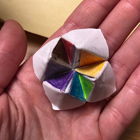 A tiny prototype made out of post-it notes for a Rainbow Squared cootie catcher.