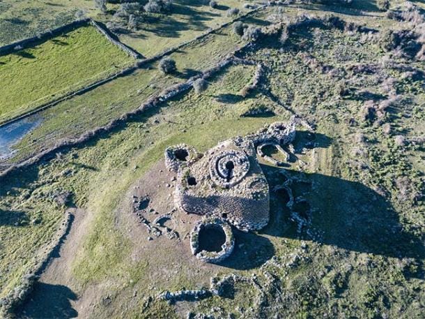 Arial view of Nuraghe Losa showing it’s triangular shape with 4 towers. (marco / Adobe Stock)