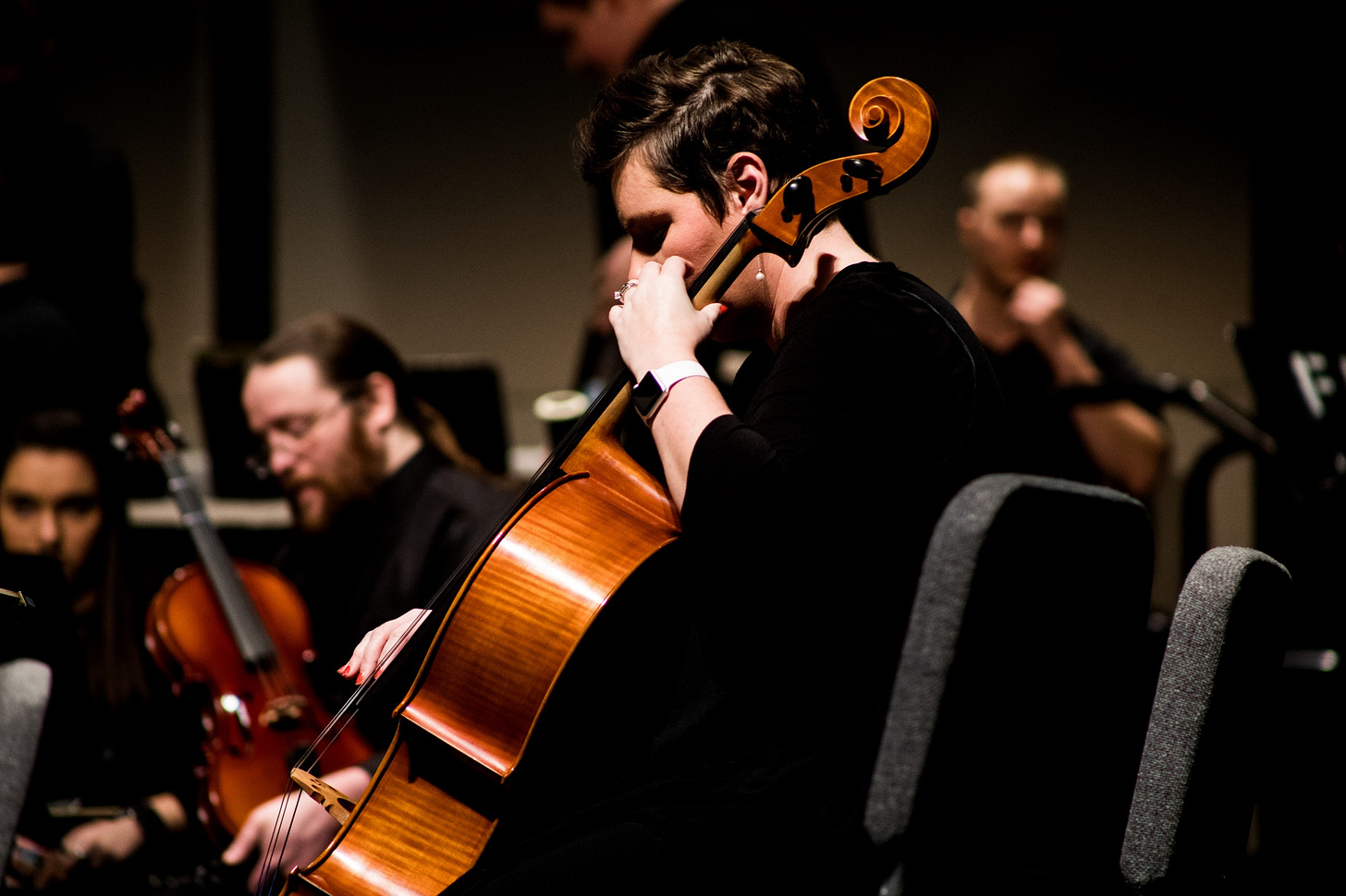 Image of a musician playing to the crowd for article by Larry G. Maguire