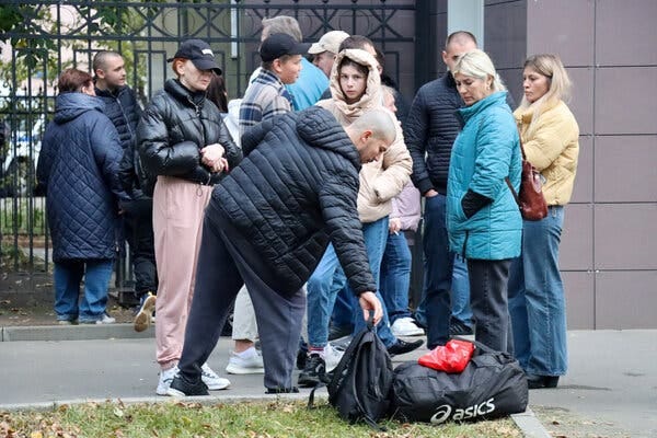 Men saying goodbye to their relatives and friends outside a military depot in Moscow on Friday, after the government called a “partial mobilization” of soldiers for the Russian Army. 