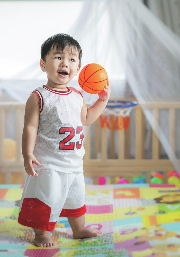 Baby with ball in basketball uniform Photograph by Anek Suwannaphoom | Fine  Art America