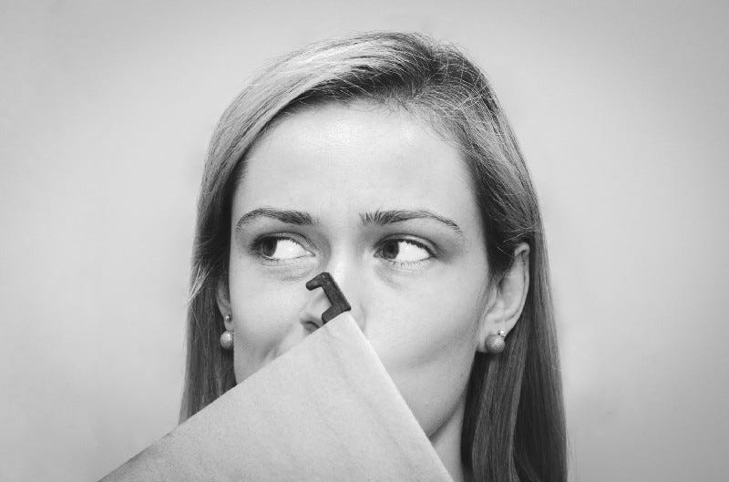 A woman behind a folder in black and white