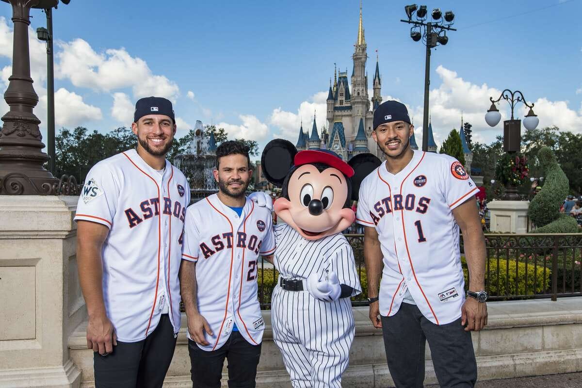 Houston Astros star players (l-r) World Series MVP George Springer, American League batting champion Jose Altuve and All-Star Carlos Correa team up with Mickey Mouse for a World Series victory parade Saturday, Nov. 4, 2017, at Magic Kingdom Park in Lake Buena Vista, Fla. The Walt Disney World Parade saluted the team?•s first world title in its 56-year history. (Matt Stroshane, photographer)