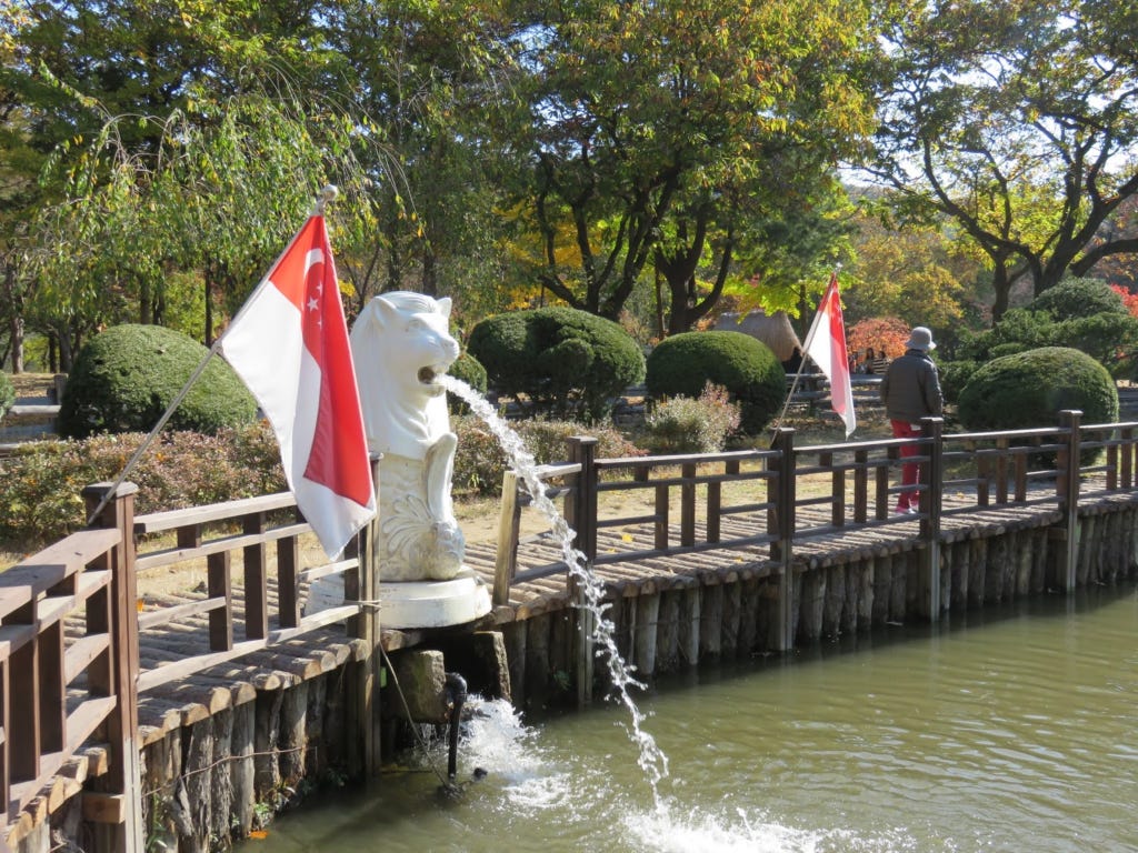 Merlion statue with the Singapore flag at Nami Island, South Korea