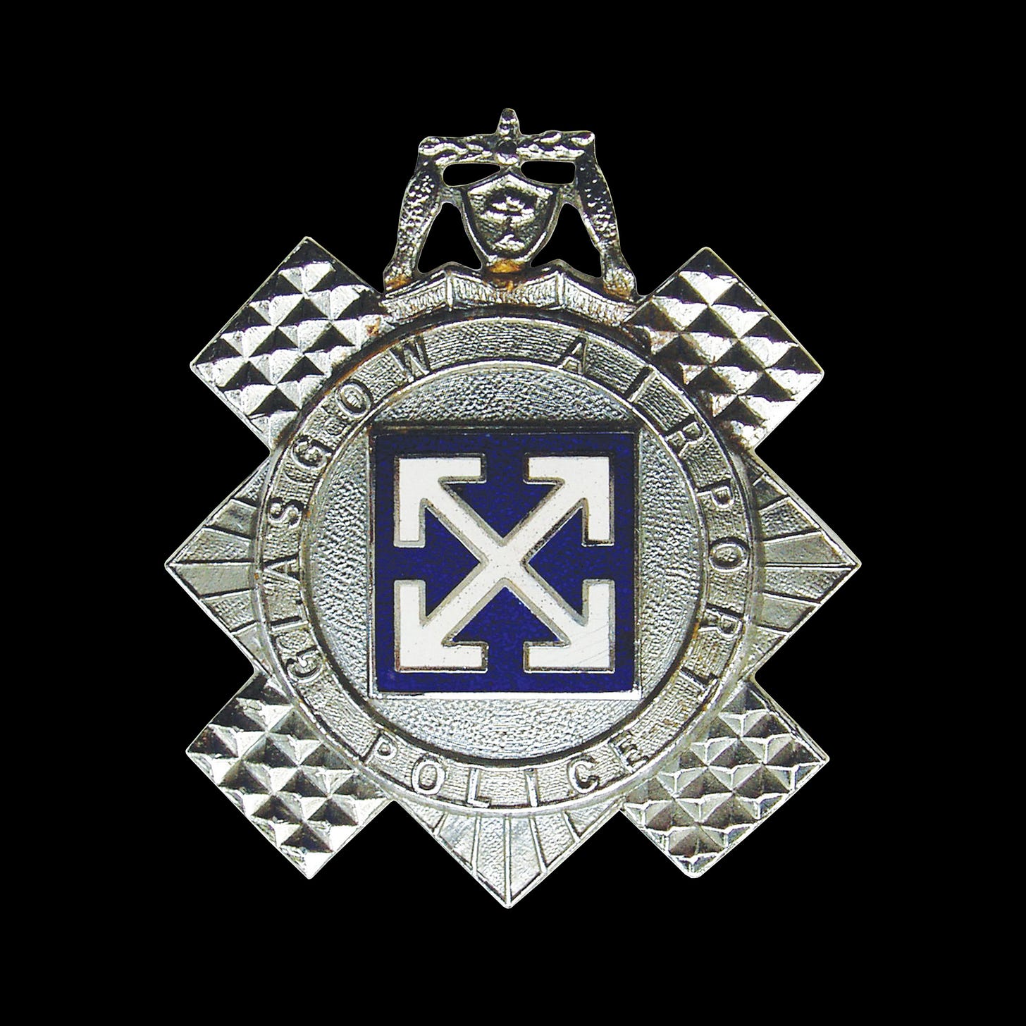 Margaret Calvert's 1964 logo for Glasgow Airport, Airport police badge