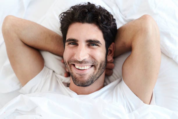 61 Young Man Lying On Bed With Hands Behind Head Portrait Stock Photos,  Pictures & Royalty-Free Images - iStock