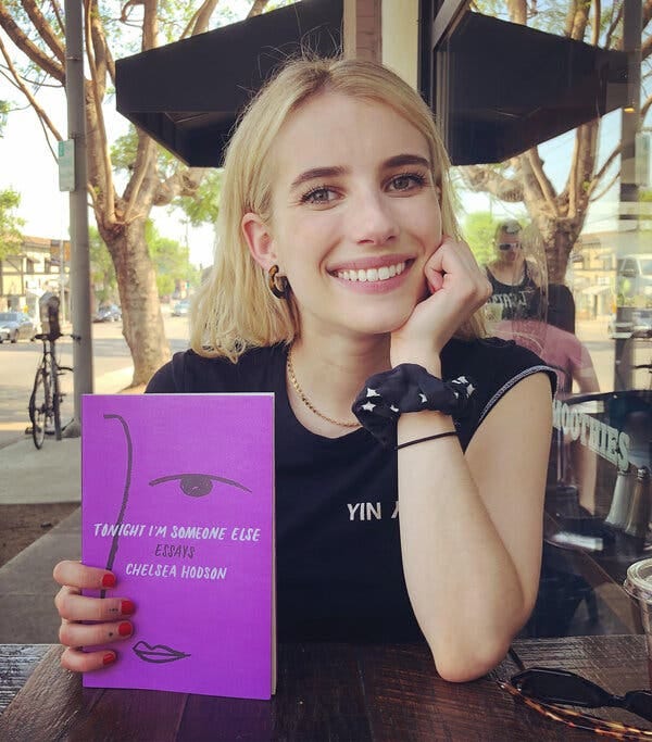 The actress and Belletrist co-founder Emma Roberts with a copy of Hodson’s book.