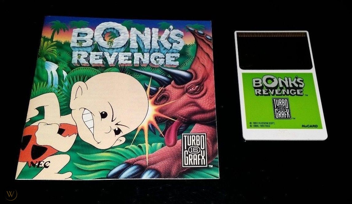 A photo of the manual for Bonk's Revenge, along with its HuCard video game cartridge