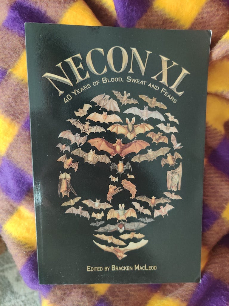 NeCon XL: 40 Years of Blood, Sweat and Fears. A black cover book with a plethora of bats.