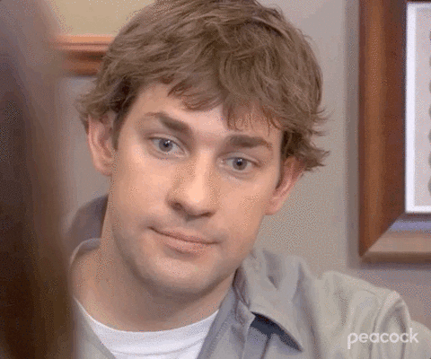 Jim Halpert from The Office raises his eyebrows in a facial expression of awkwardness.