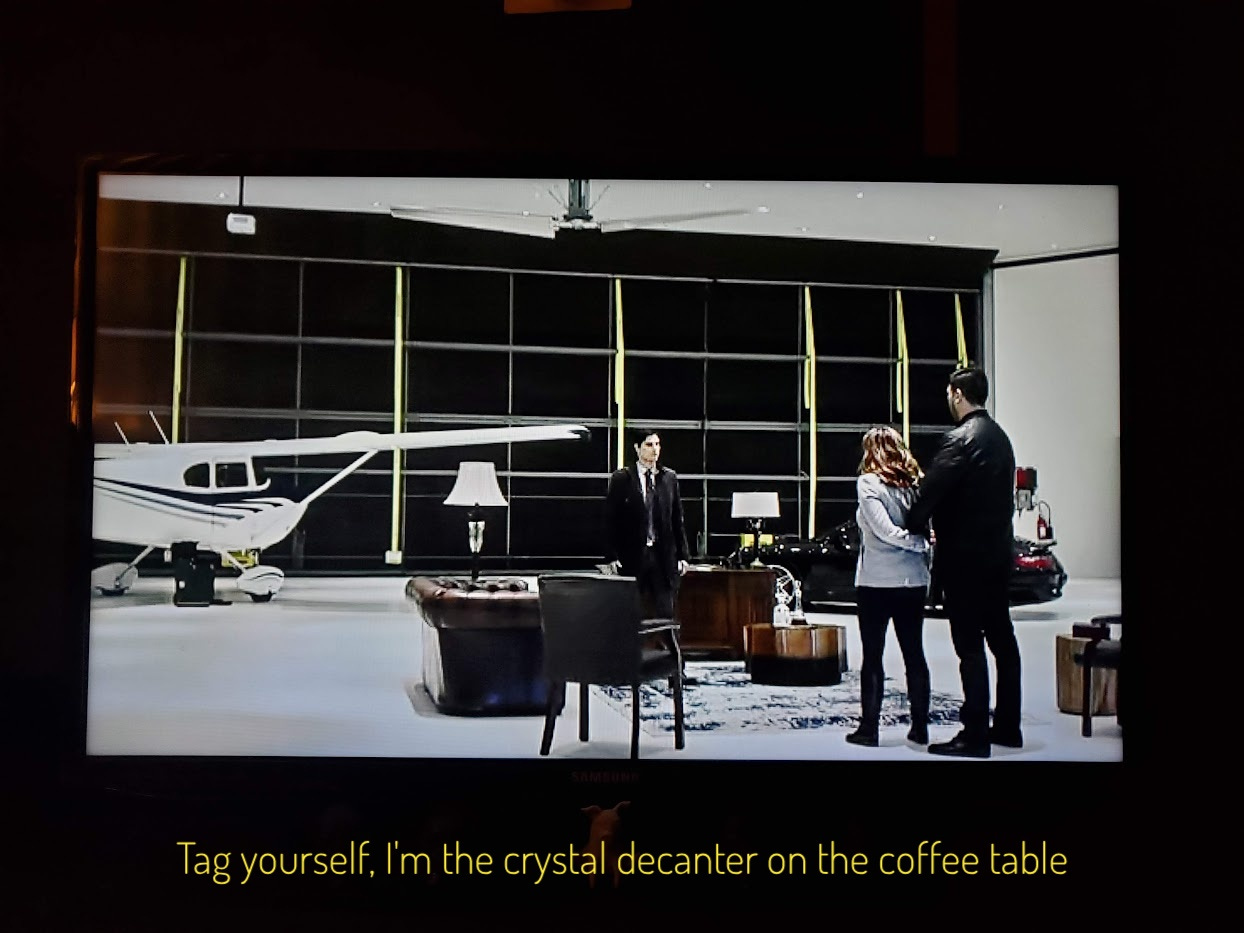 Quinlan's office hangar, captioned "Tag yourself, I'm the crystal decanter on the coffee table"