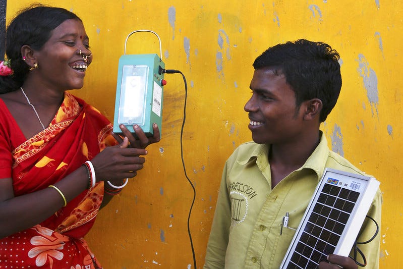 Women who have been trained in solar-engineering in Tinginaput, India bring light and electricity to their homes. The smiles on these people's faces bring what could otherwise be another dull 'technical' photo of solar technologies to life. Region: Tinginaput Country: India 30/09/2009