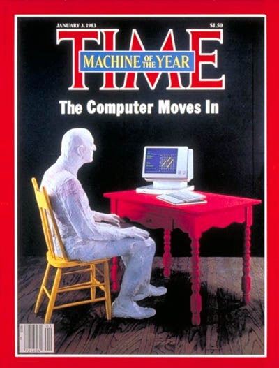 Cover of Time Magazine. Man sitting at a desk looking at a computer. Headline "The Computer Moves In"