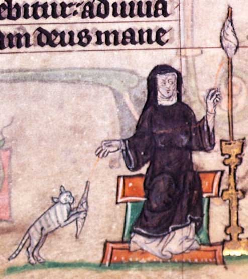 A cat holds wool for a woman winding thread.