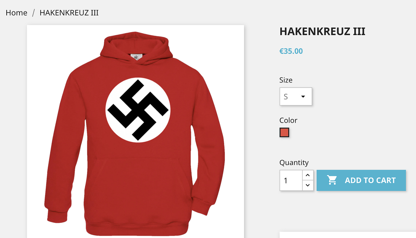 On left, picture of a red hooded sweatshirt on a white background. The sweatshirt is scarlet red with a white circle centered on the front and a black Nazi hakenkreuz in the center of the white circle. On the right is titled in capital letters: “HAKENKREUZ III” in black font. Below that is: “35.00 Euros” in light blue font. Below that shows the choice for size and below that the red color of the sweatshirt in a small black box. And below that is the option to select the quantity of the order.