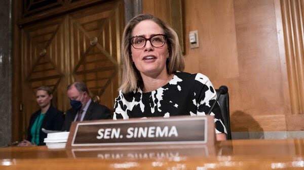 Sen. Kyrsten Sinema (D-Ariz.) said Thursday that she would "move forward" with Senate Democrats' spending bill to tackle climate change, health care and tax reforms.