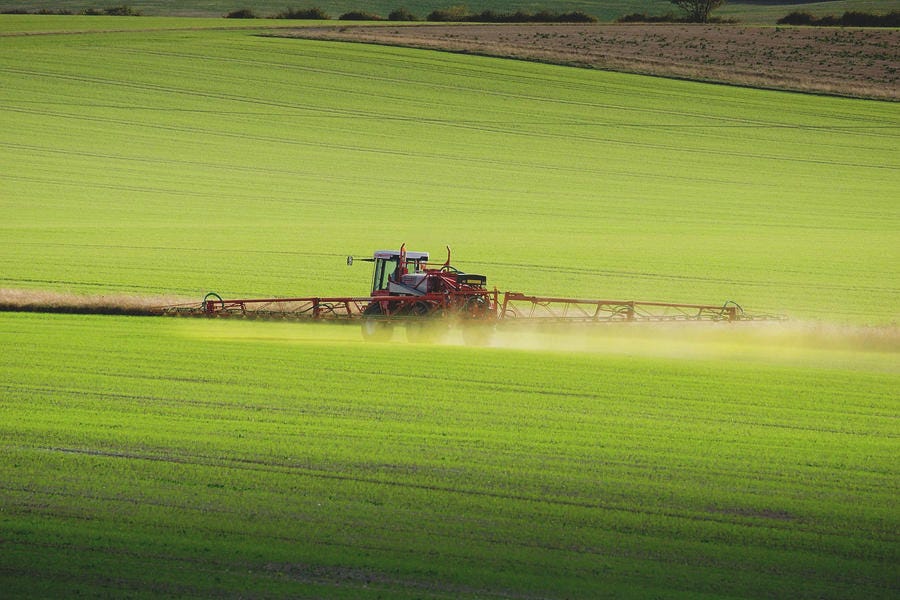 Fertiliser Spraying Tractor Rides by Charles Bowman