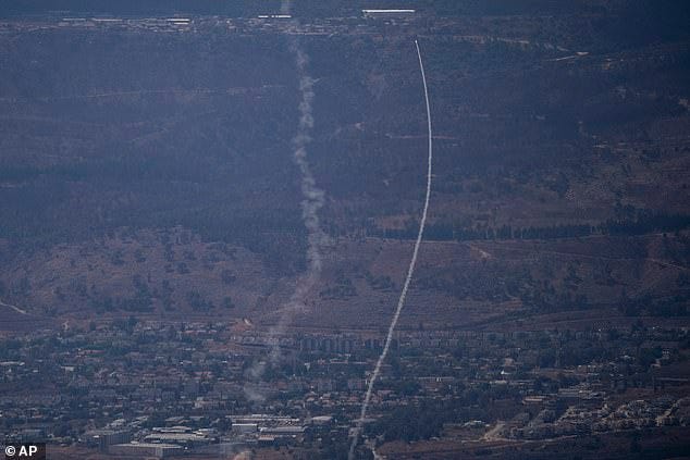 The Israeli Iron Dome air defense system fires to intercept an attack from Lebanon over the Galilee region, near Kiryat Shmona, as seen from the Israeli-annexed Golan Heights, Tuesday, Sept. 17, 2024