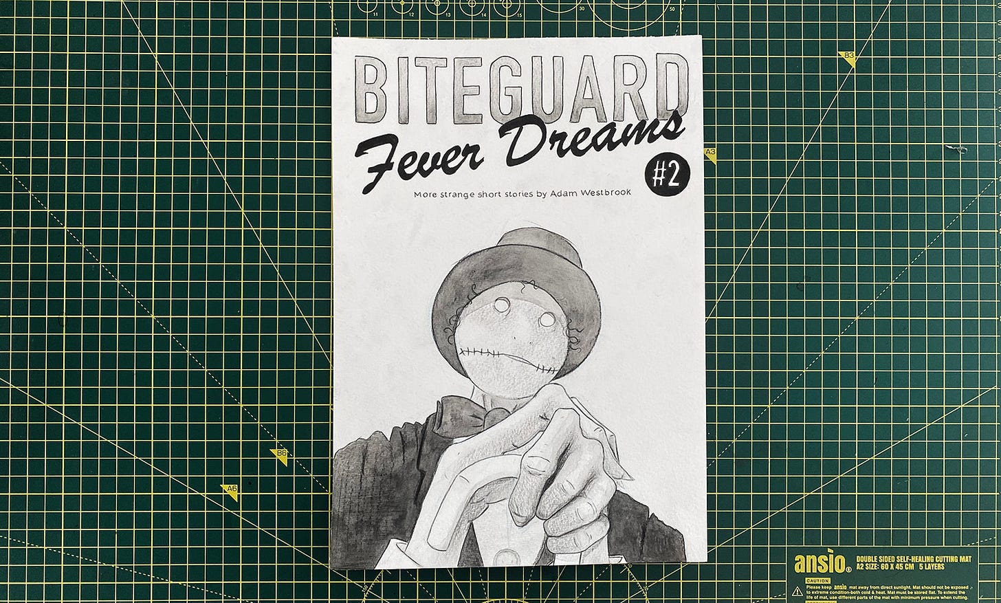 A photograph of the front cover of Biteguard Fever Dreams, by Adam Westbrook