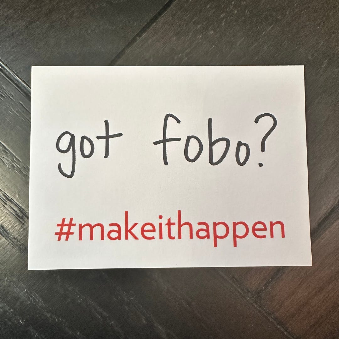 a photo of a sticky note that has, “got fobo?” written on it and includes #makeithappen preprinted on the bottom