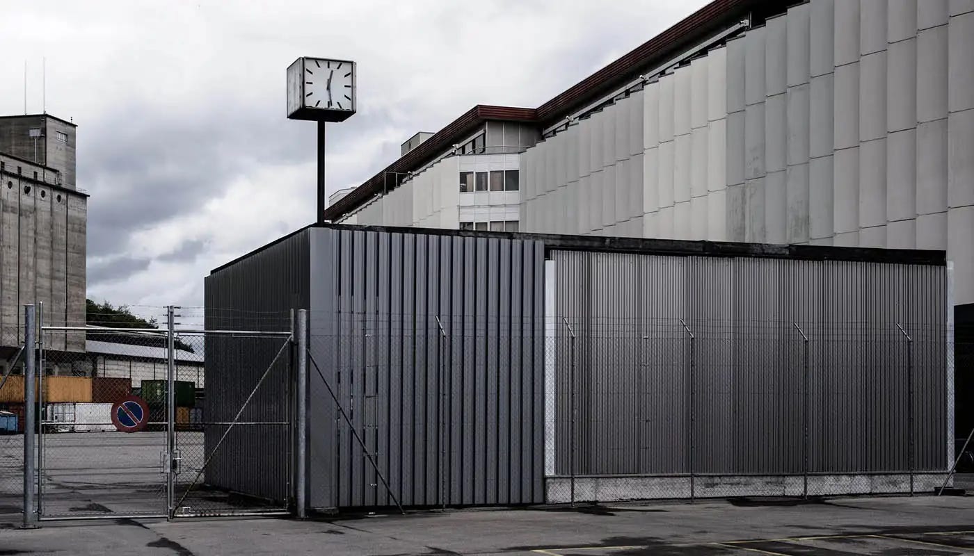 A dark and forboding Geneva Free Port, behind barbed wire.