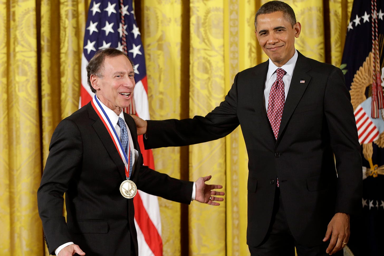 President Barack Obama awards the National Medal of Technology and Innovation to Dr. Robert Langer of the Massachusetts Institute of Technology, Friday, Feb. 1, 2013, during a ceremony in the East Room of the White House in Washington. The awards are the highest honors bestowed by the United States Government upon scientists, engineers, and inventors. (AP Photo/Charles Dharapak)