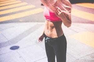 Woman in running pants and sports bra