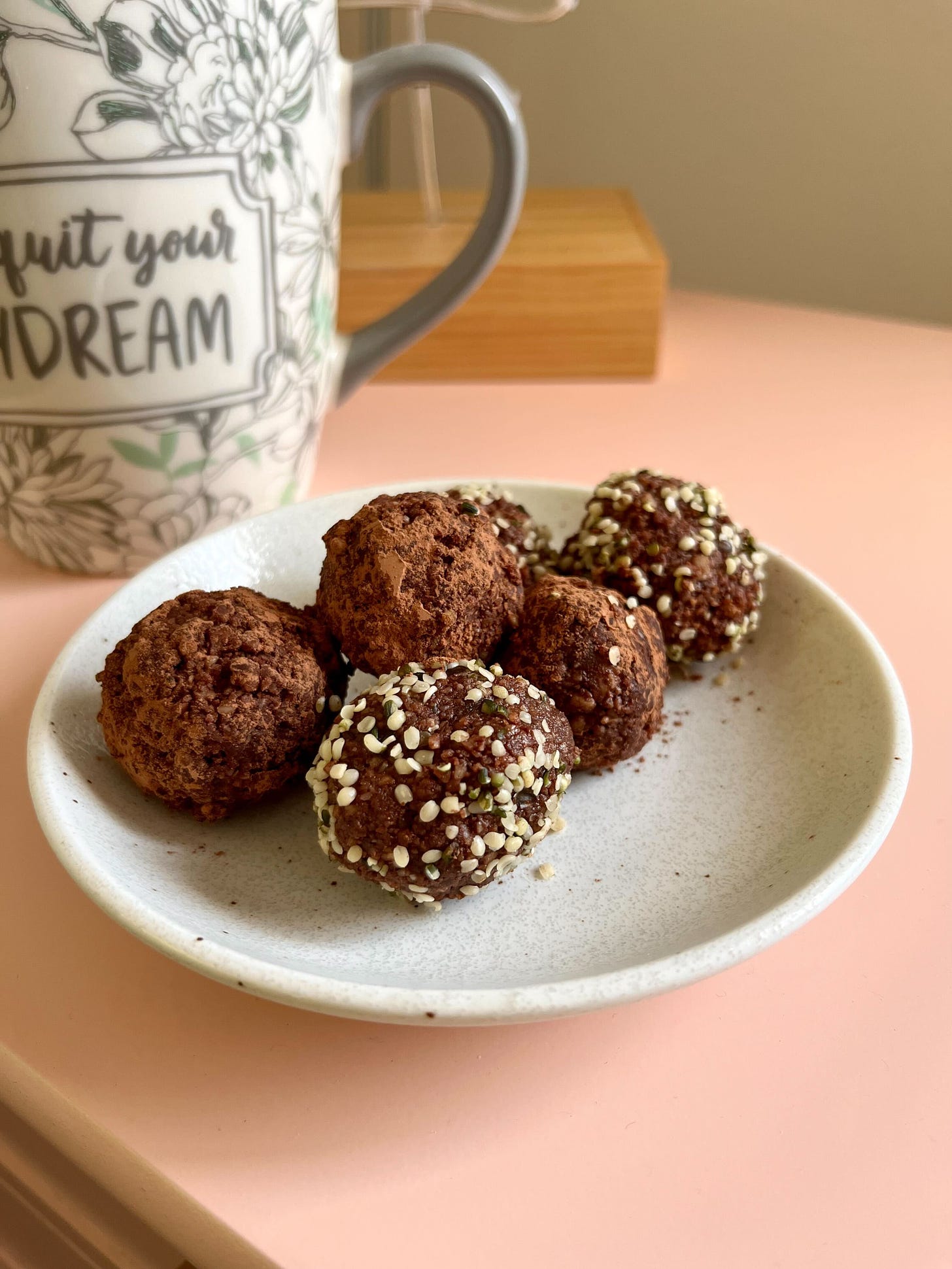 chocolate truffles dusted with cocoa powder and hemp seeds