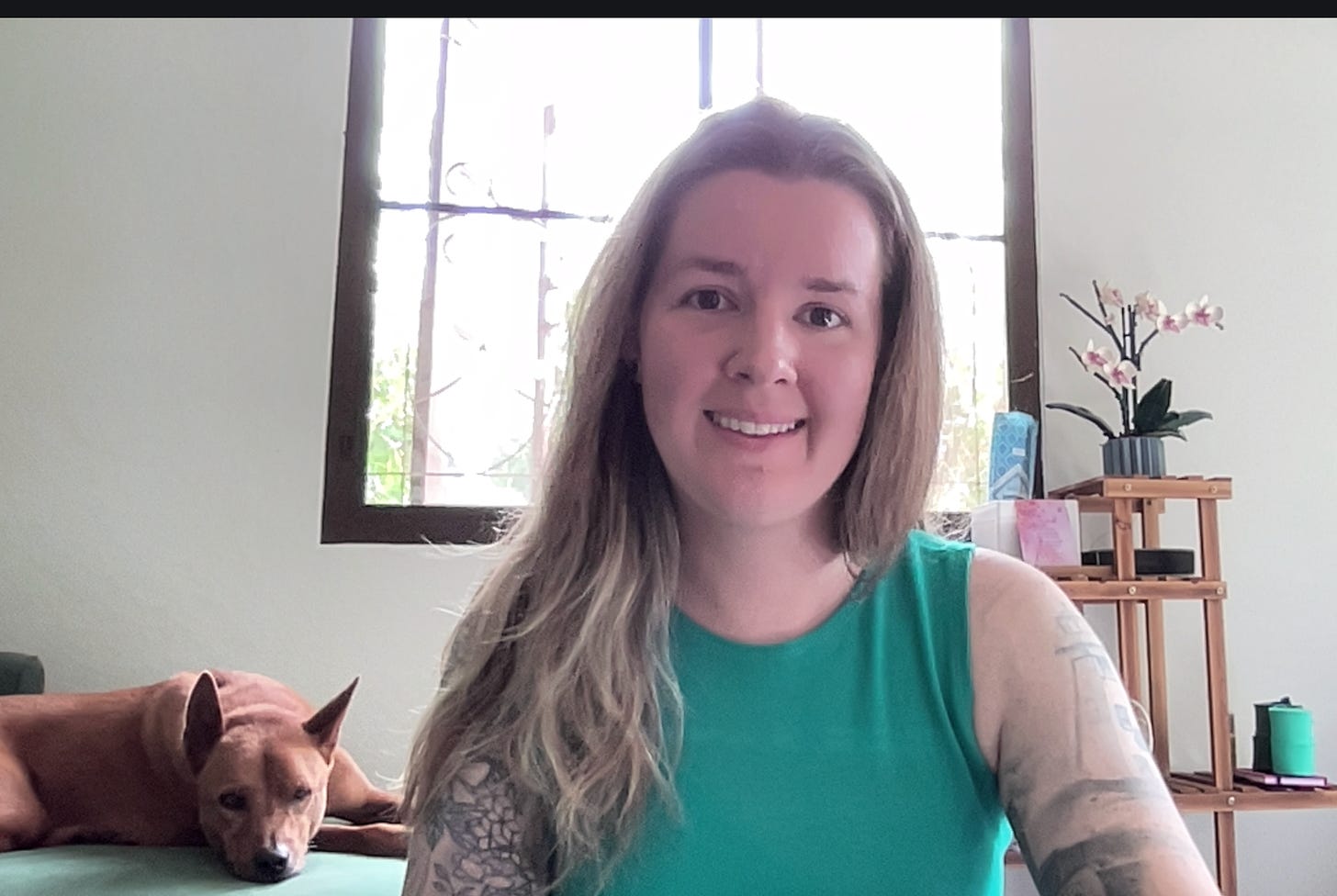 a screenshot of me and my dog, Lady, during one of our new moon workshops